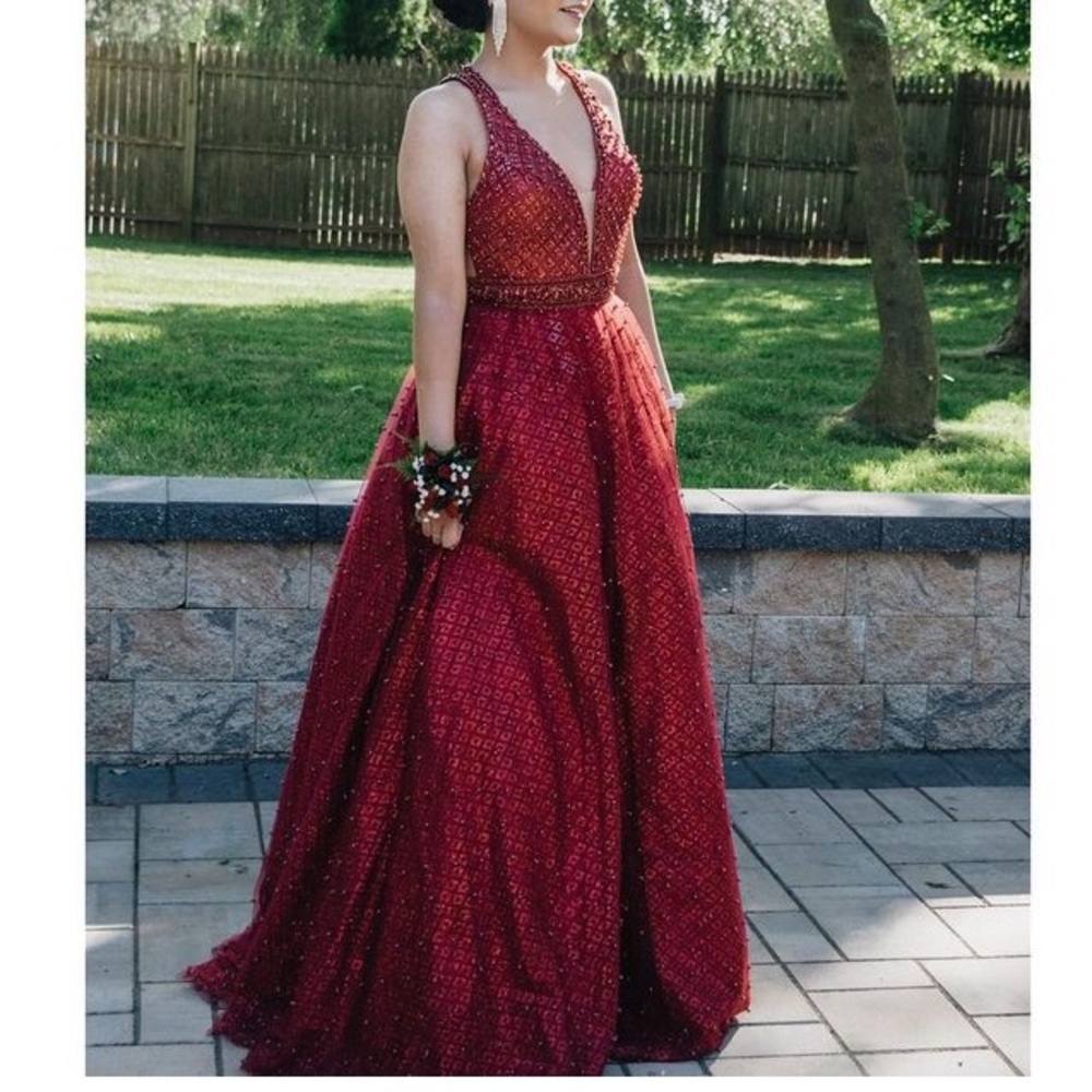 A red prom dress, only worn once. Still brand new. Size: 6
